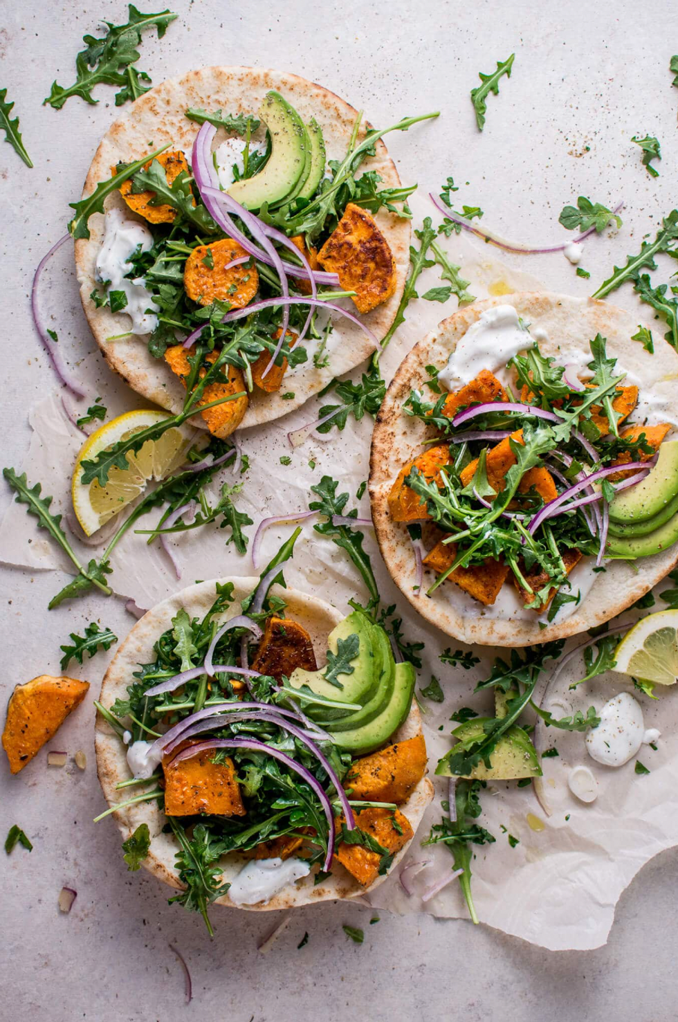 Roasted Sweet Potato Pitas with Arugula and Garlic Dressing