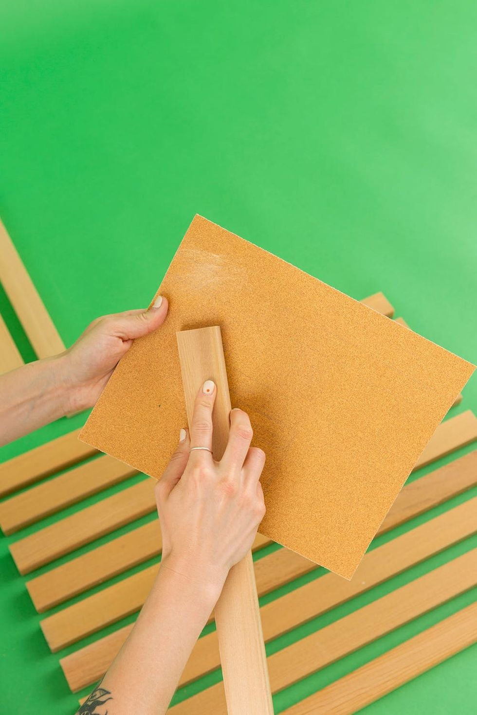 sanding the cedar panels