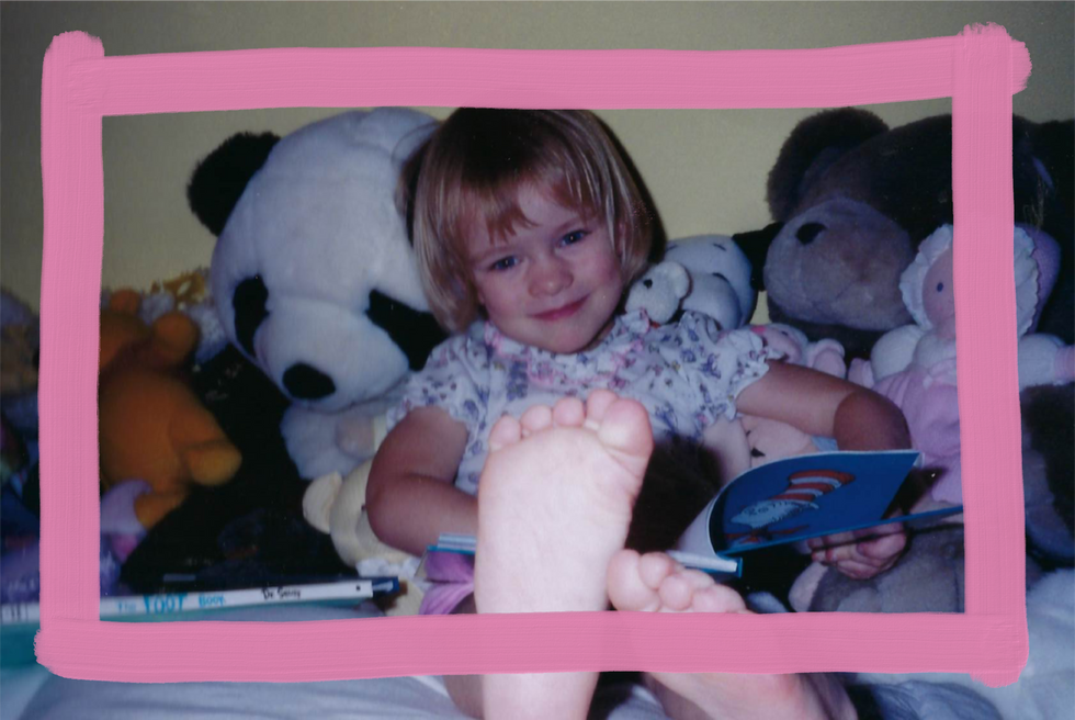 sitting on the bed reading to my stuffed animals