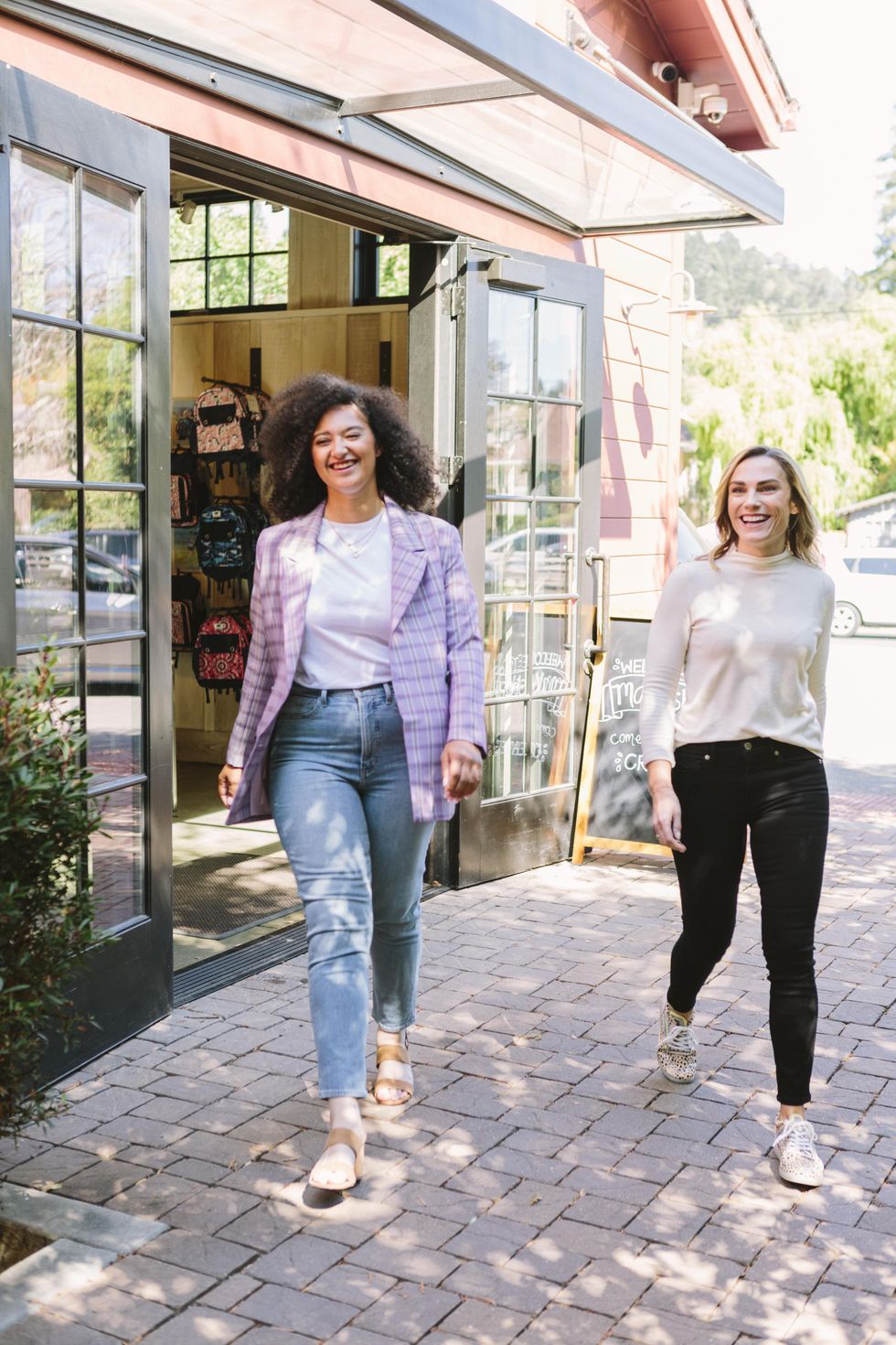 Support a local shop women walking together and laughing