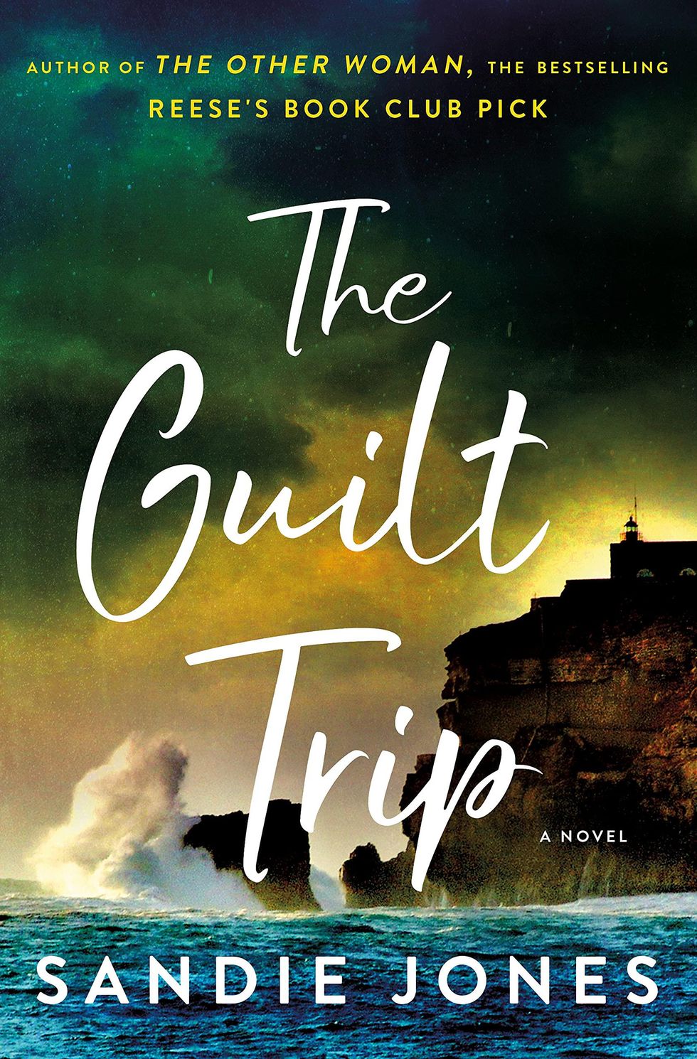 the guilt trip cover of a building on a cliff and water breaking on the cliff, and white lettering