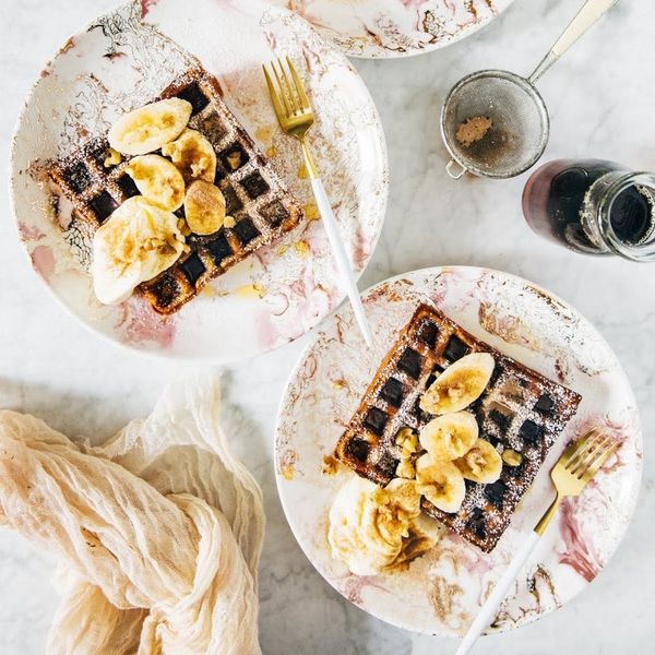 https://www.brit.co/media-library/this-waffle-paleo-breakfast-rests-on-a-white-plate-with-chocolate-sauce-bananas-and-whip-cream.jpg?id=21195634&width=600&quality=90