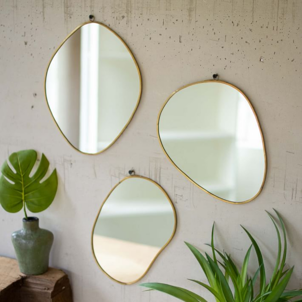 trio of West Elm Brass Framed Organic Shape Mirrors