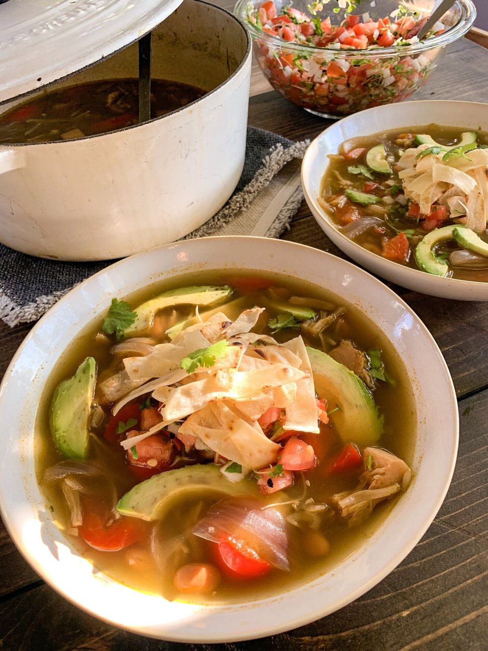 Two Bowls Of Soup Are On A Wooden Surface ?id=48586141&width=980