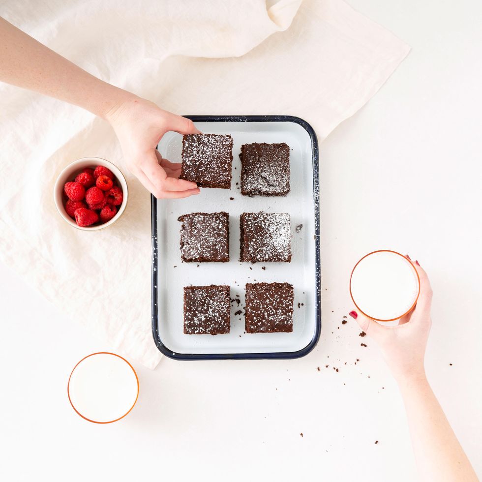 two friends baking brownies together