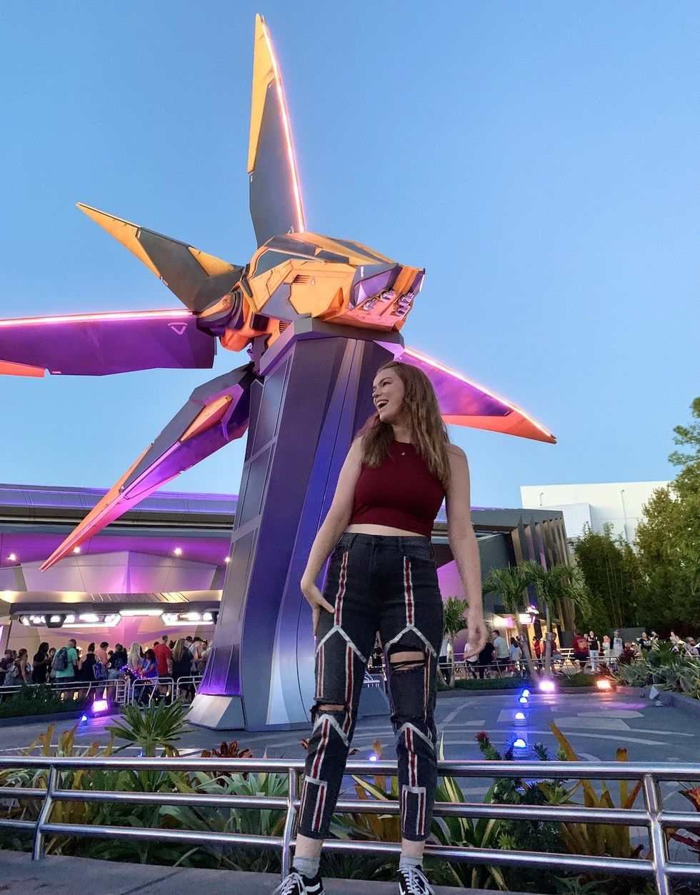 \u200bChloe standing outside the Guardians of the Galaxy roller coaster dressed as Wanda Maximoff