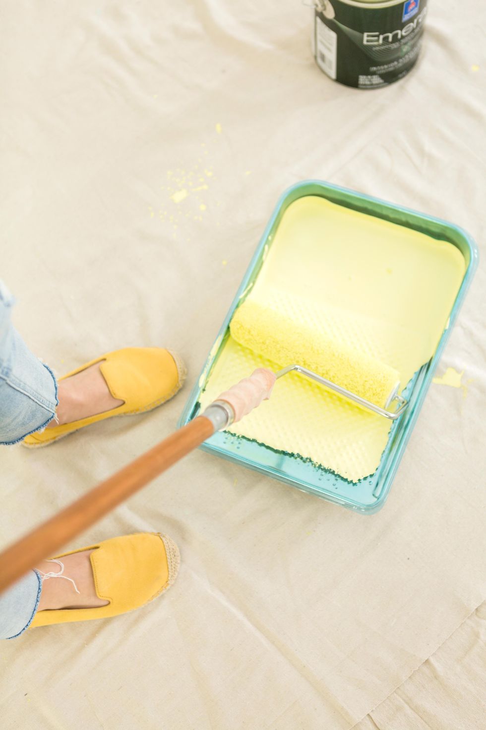 Use a 9" roller and paint to cover the wall and ceiling.