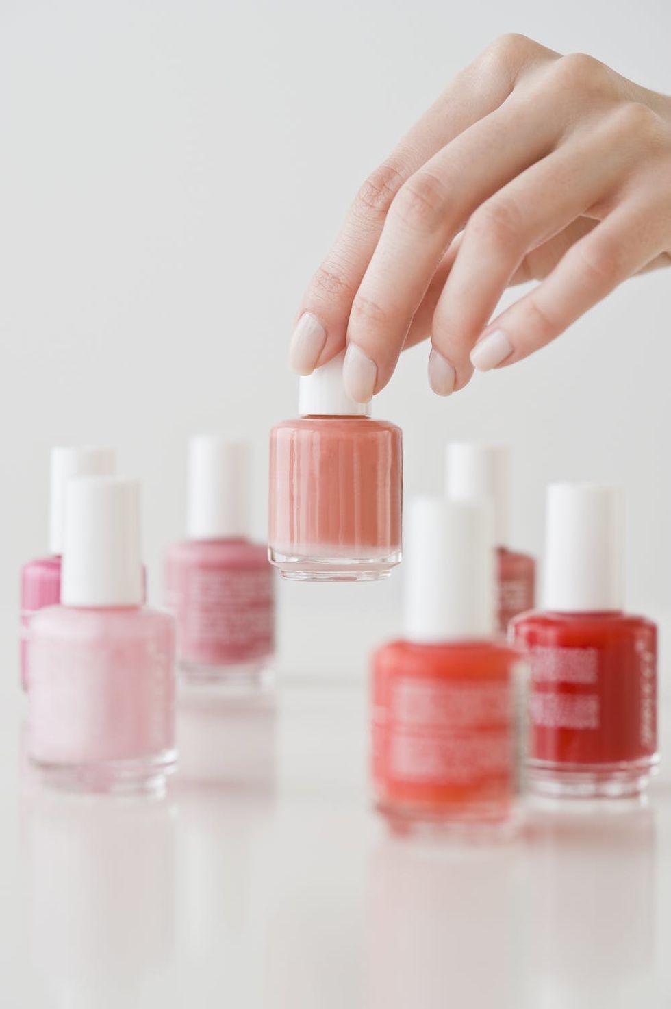 Woman choosing nail polish color. 