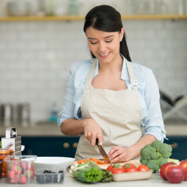 https://www.brit.co/media-library/woman-chopping-vegetables-in-the-kitchen.jpg?id=34309847&width=600&height=600&quality=90&coordinates=400%2C0%2C0%2C0