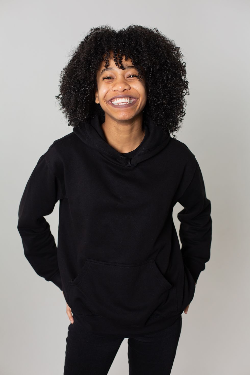 woman dressed in all black smiling