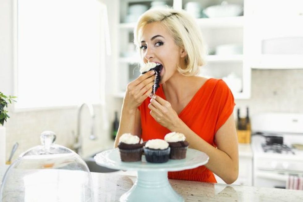 woman eating cupcakes header