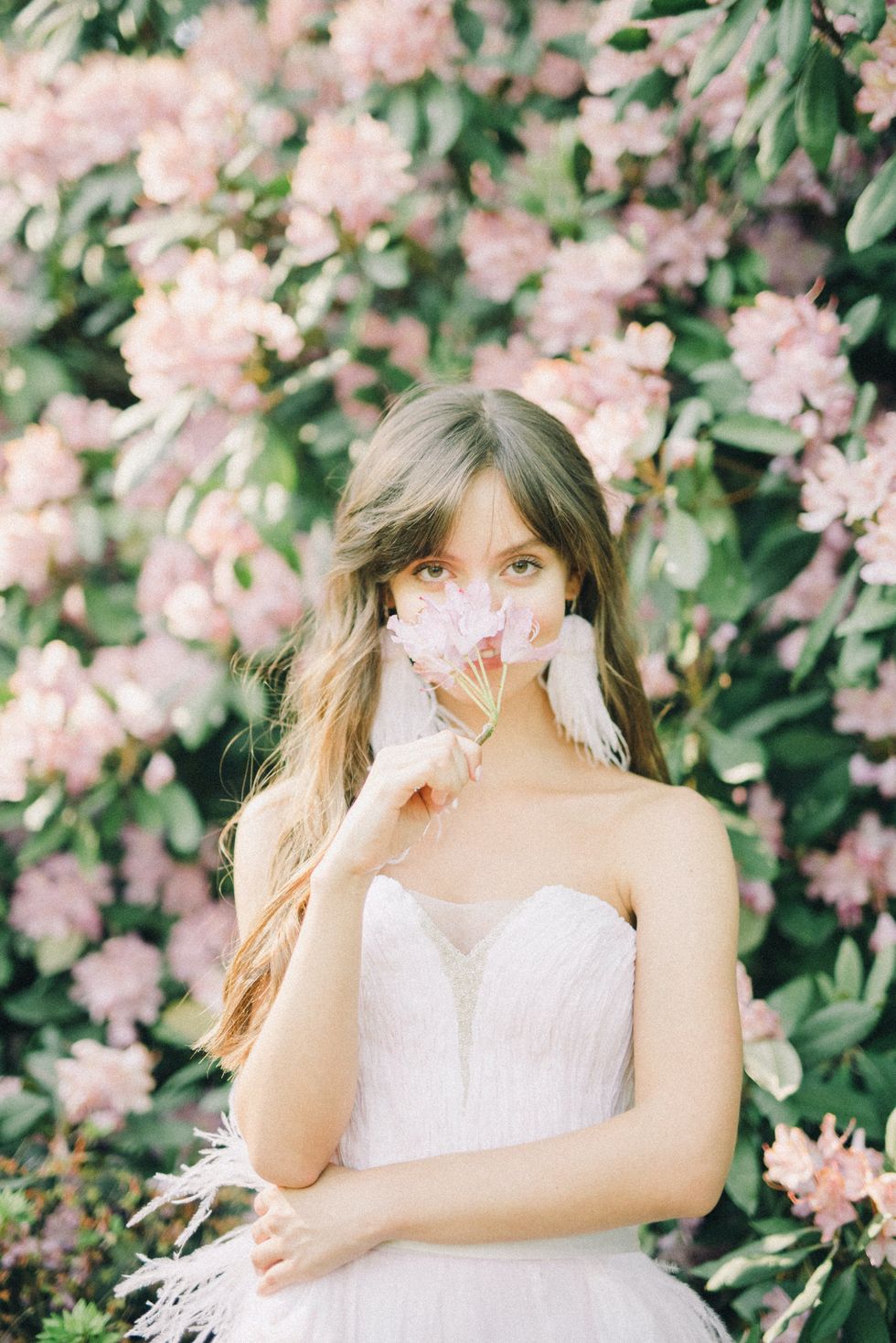 woman in dress against a floral background