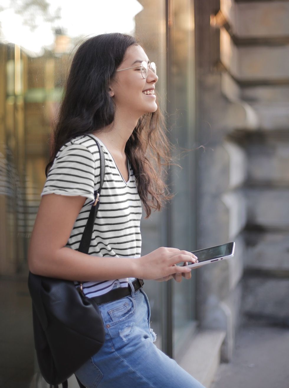 woman in striped shirt and denim