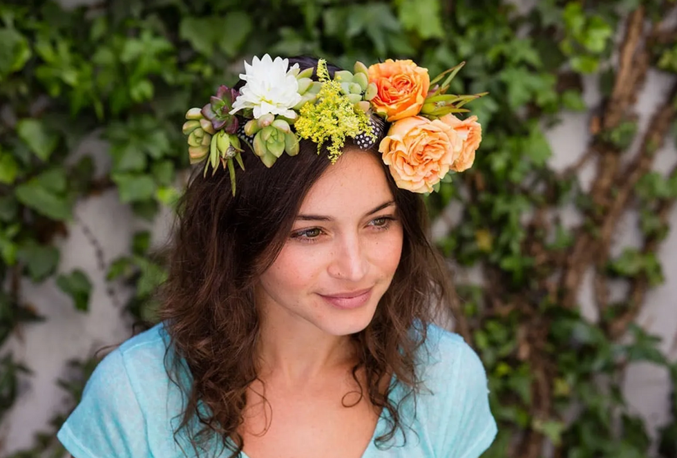 woman making a flower crown