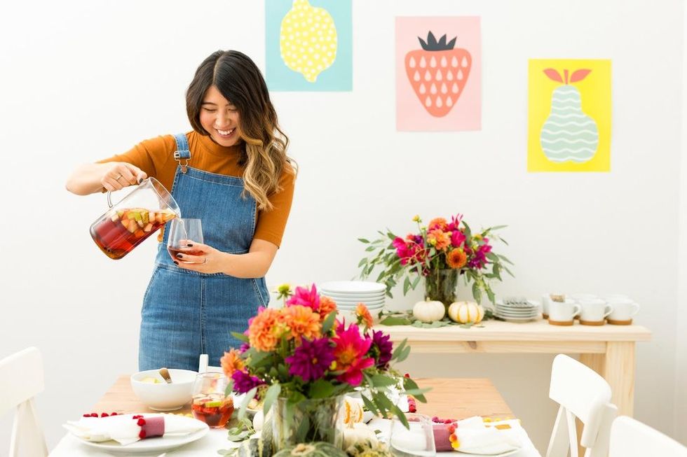 woman pouring autumn drink Fall Vibes