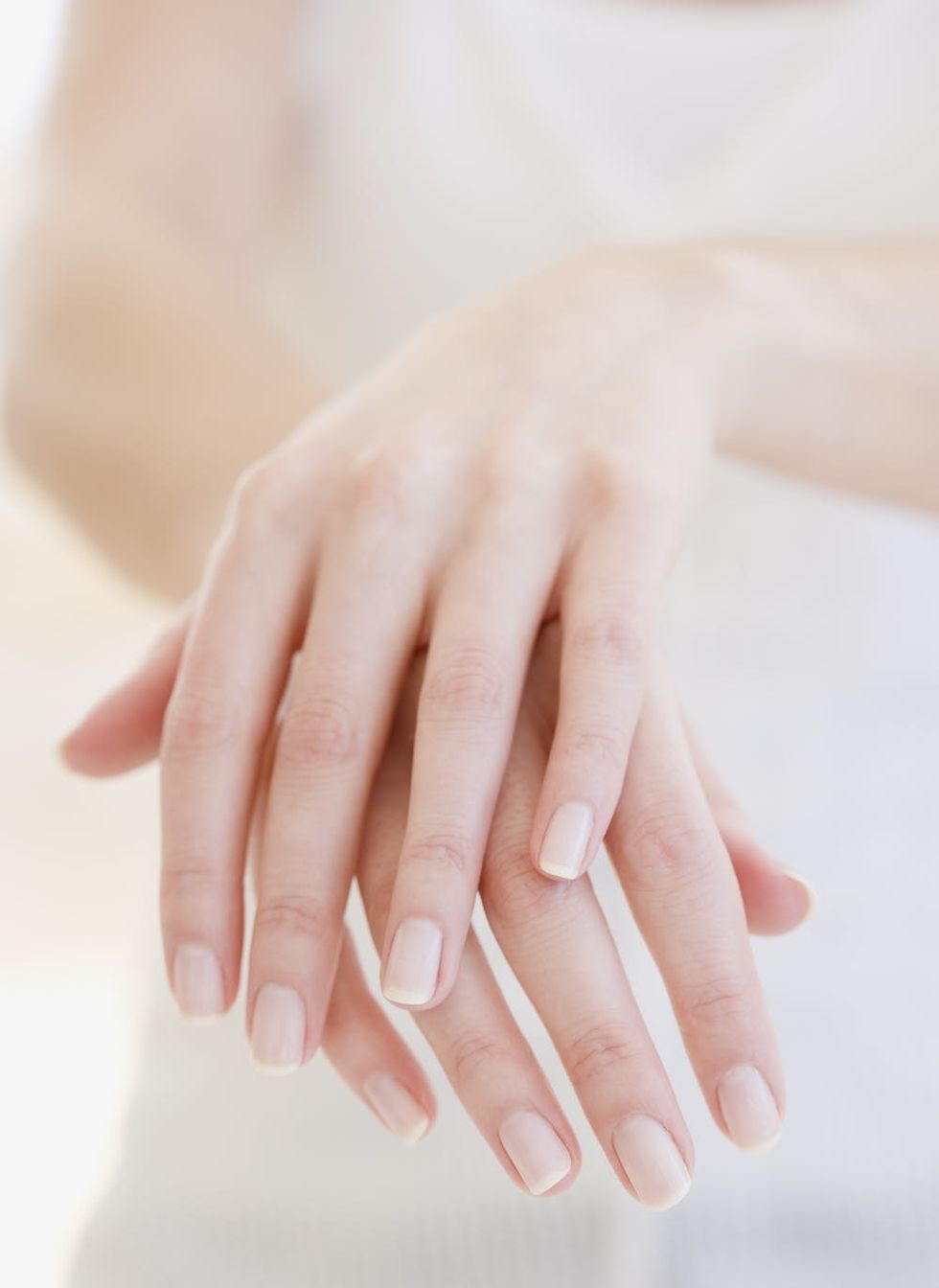 Woman's hands laid over each other. 