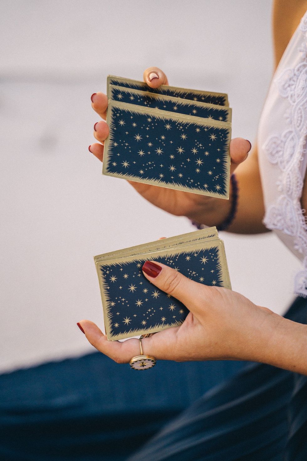 woman shuffling tarot cards