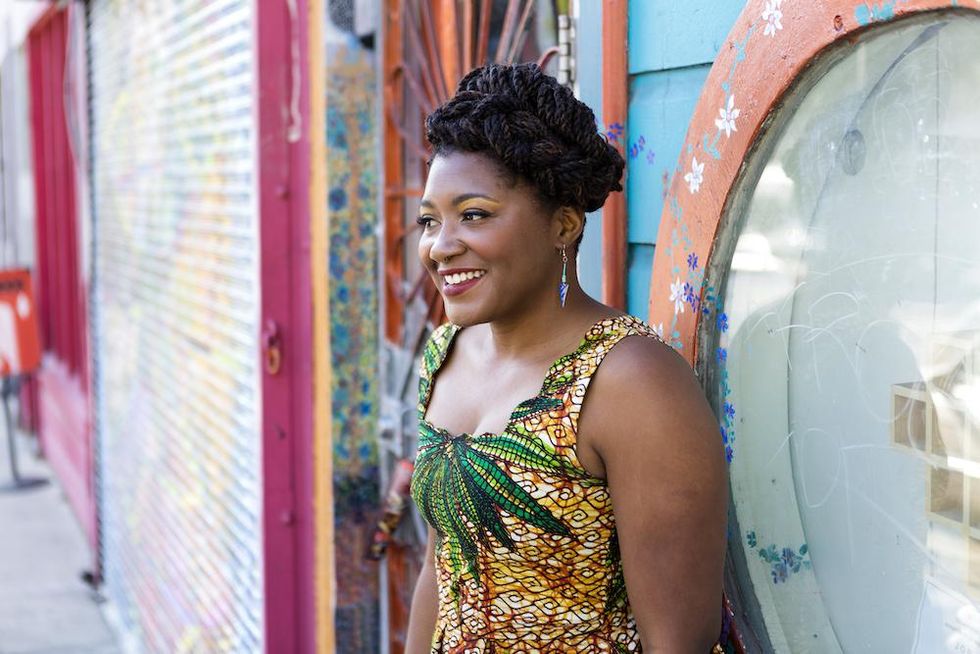 woman standing outside smiling