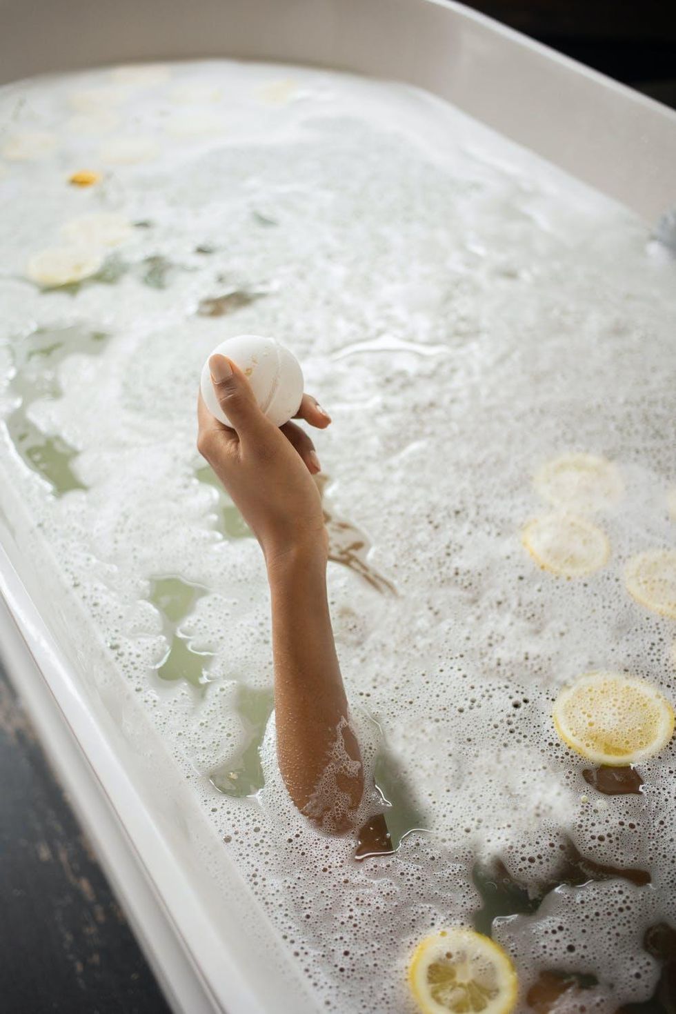 woman taking a bubble bath with lemons Fall Vibes