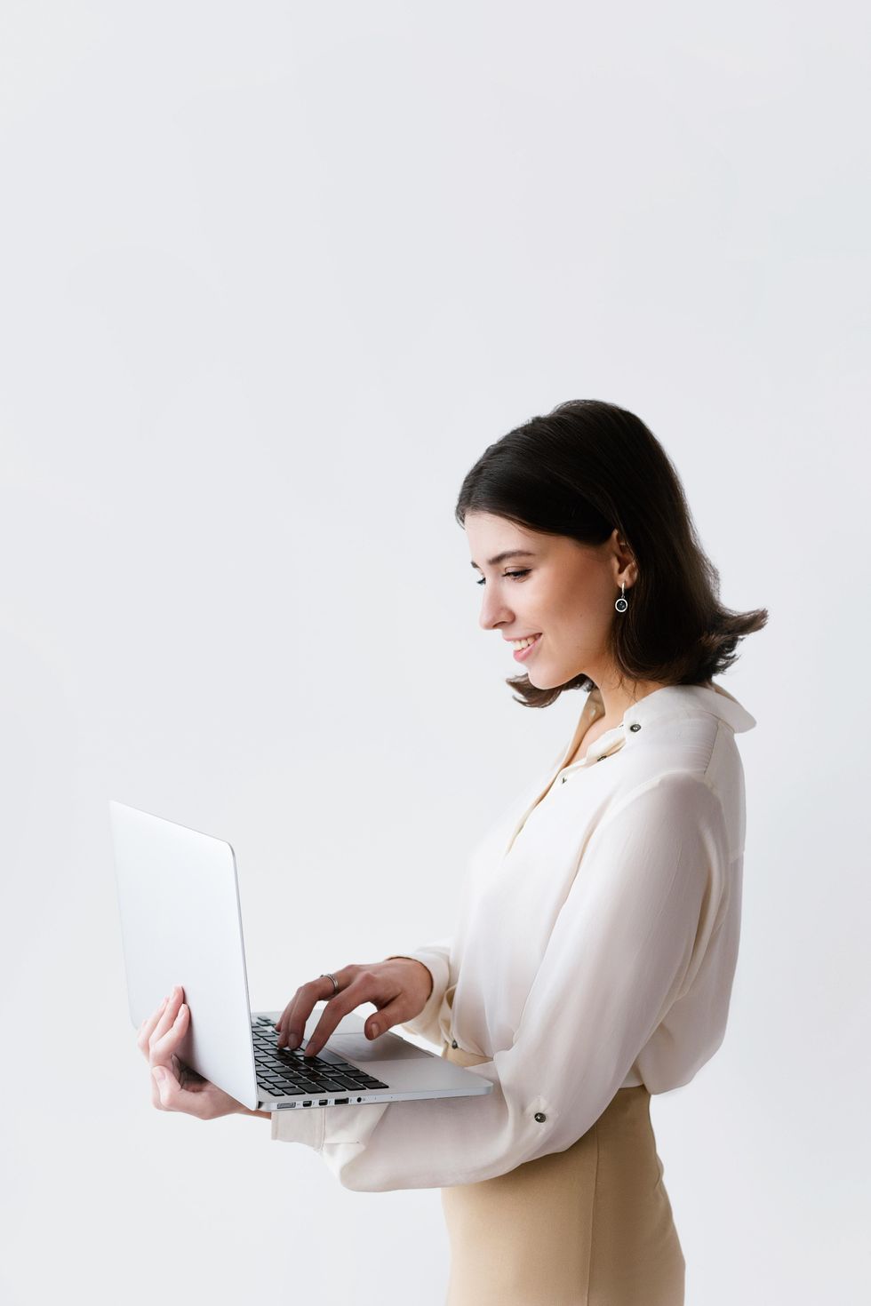 Woman typing on laptop