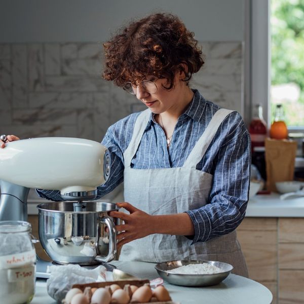 https://www.brit.co/media-library/woman-using-stand-mixer-in-kitchen.jpg?id=34310057&width=600&height=600&quality=90&coordinates=172%2C0%2C228%2C0