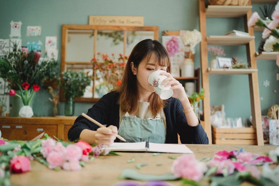 woman working and drinking coffee