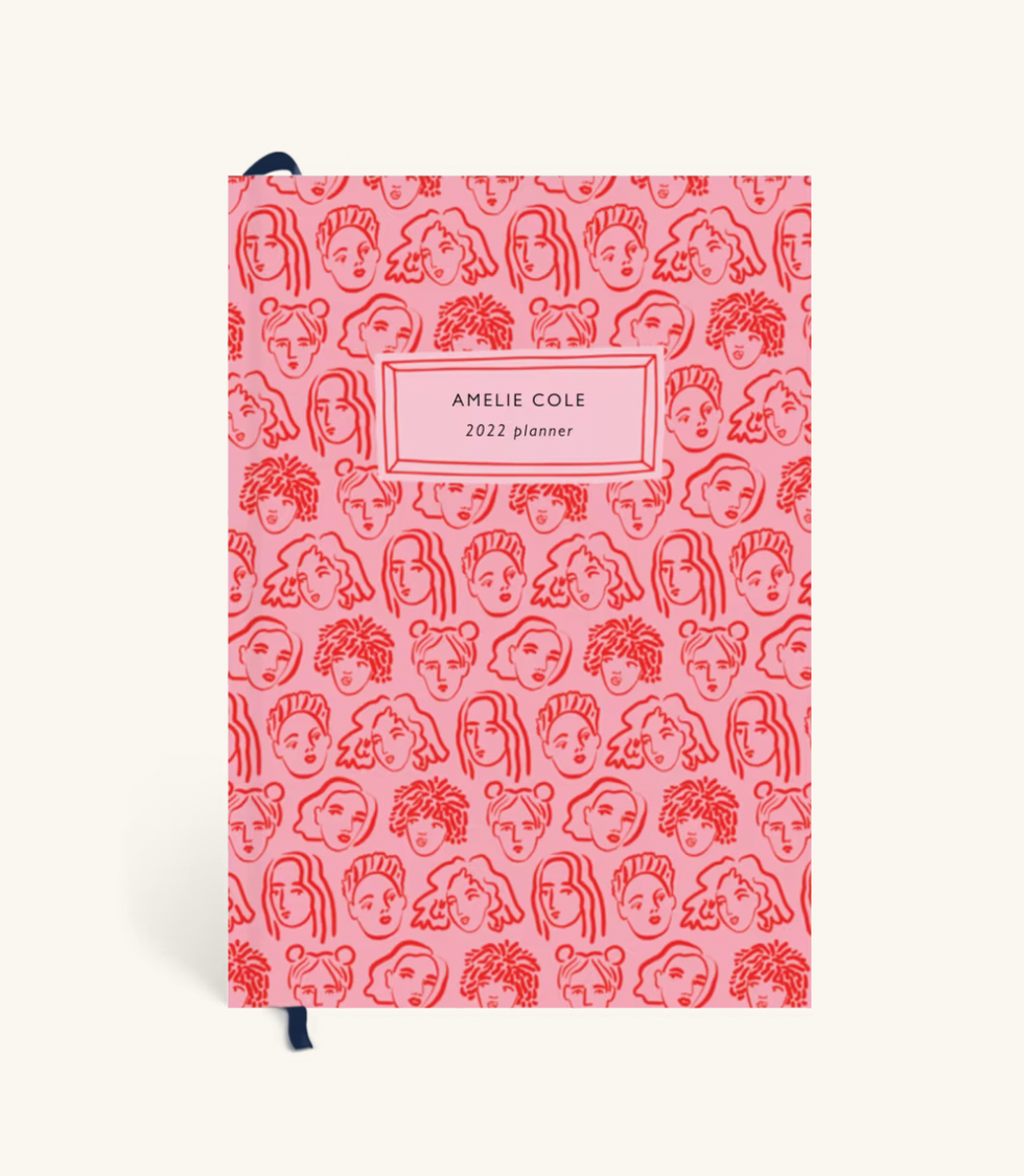 women faces planner pink background with red designs