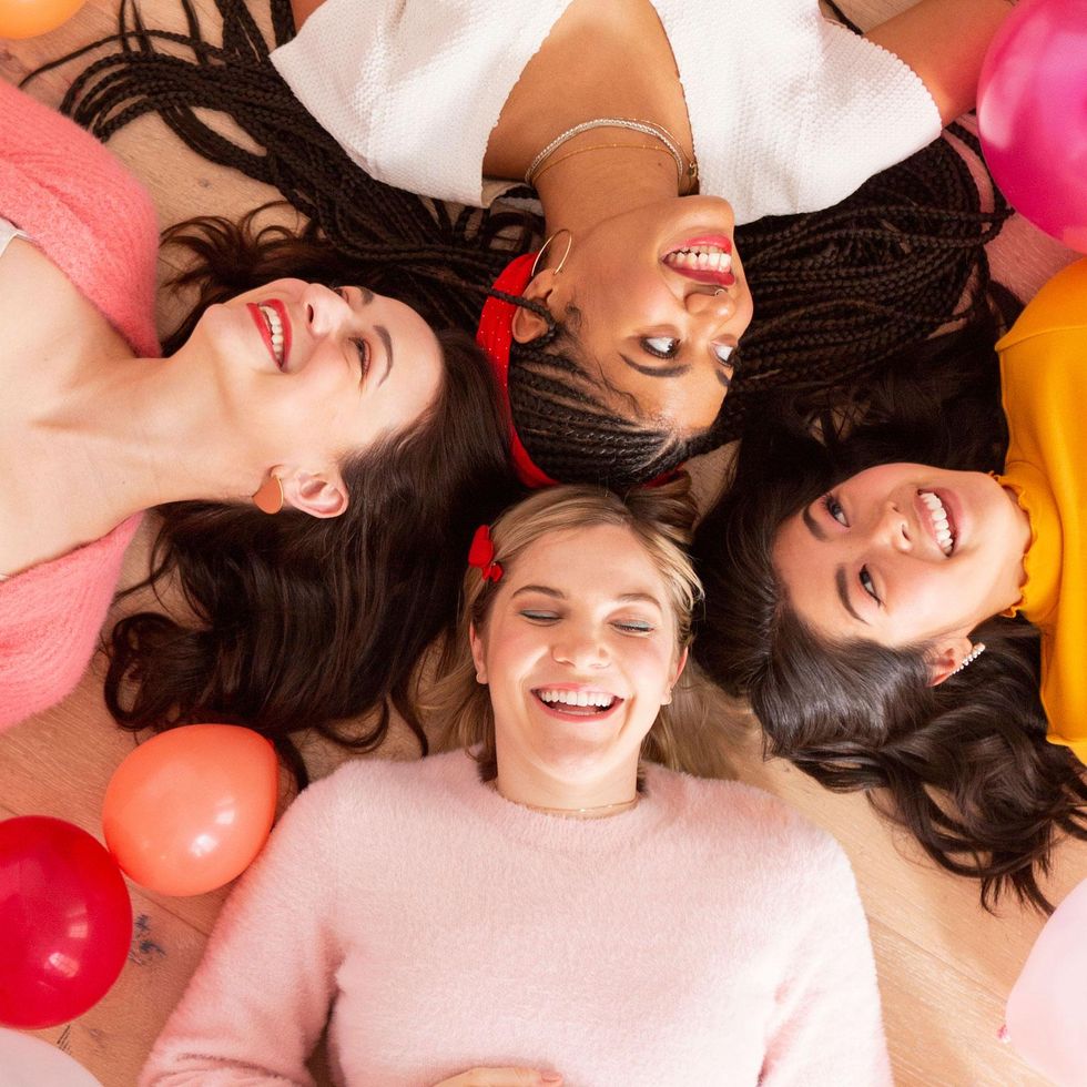 women laughing together childhood trauma