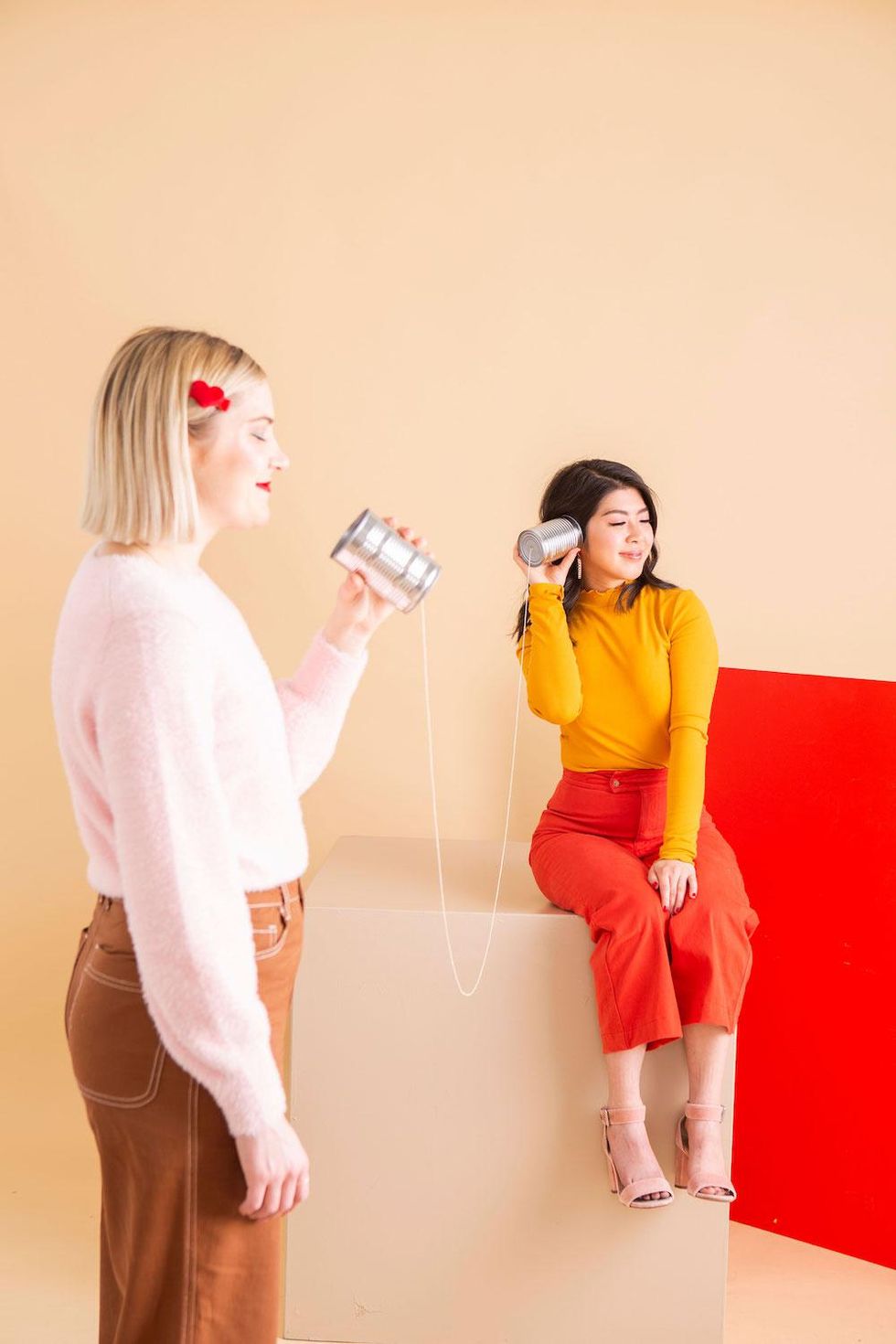 words of affirmation two girls talking through cans love language