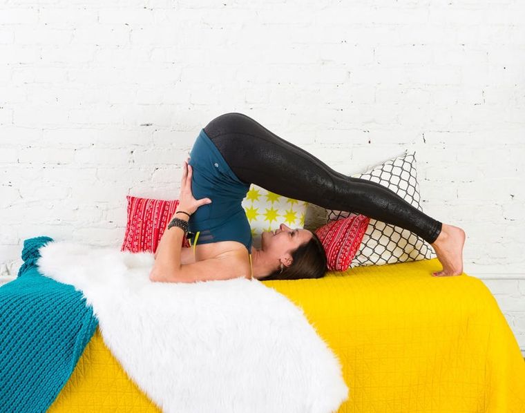 6 Lazy Girl Yoga Poses You Can Do Without Leaving Your Bed - Brit + Co