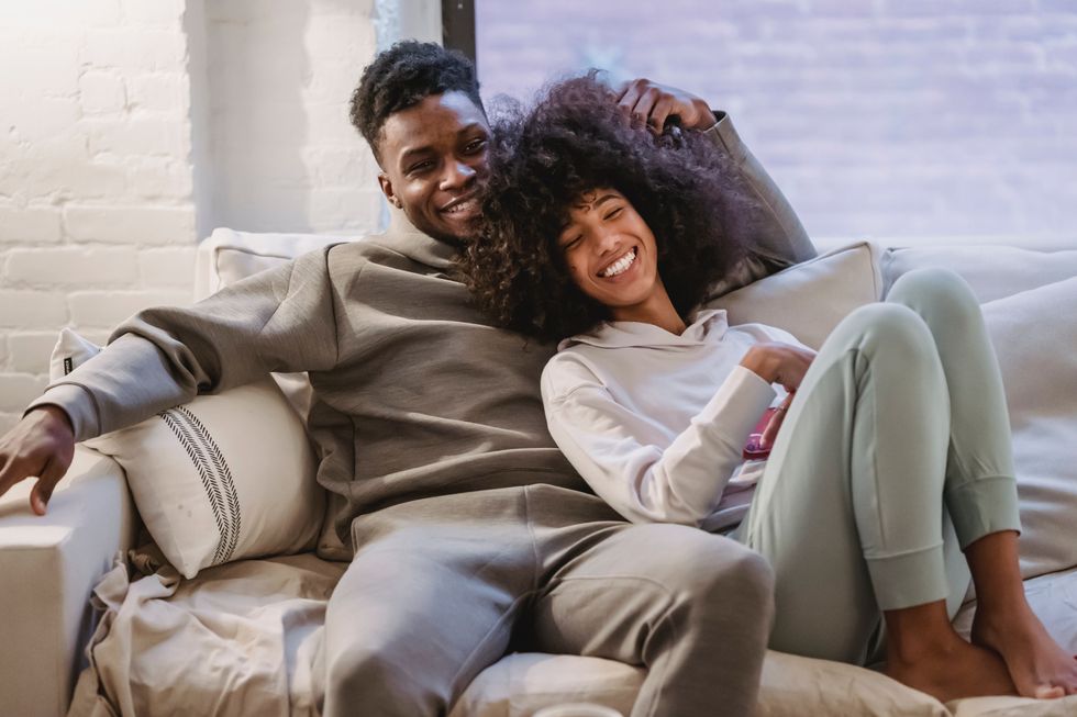 young couple spending time together on couch